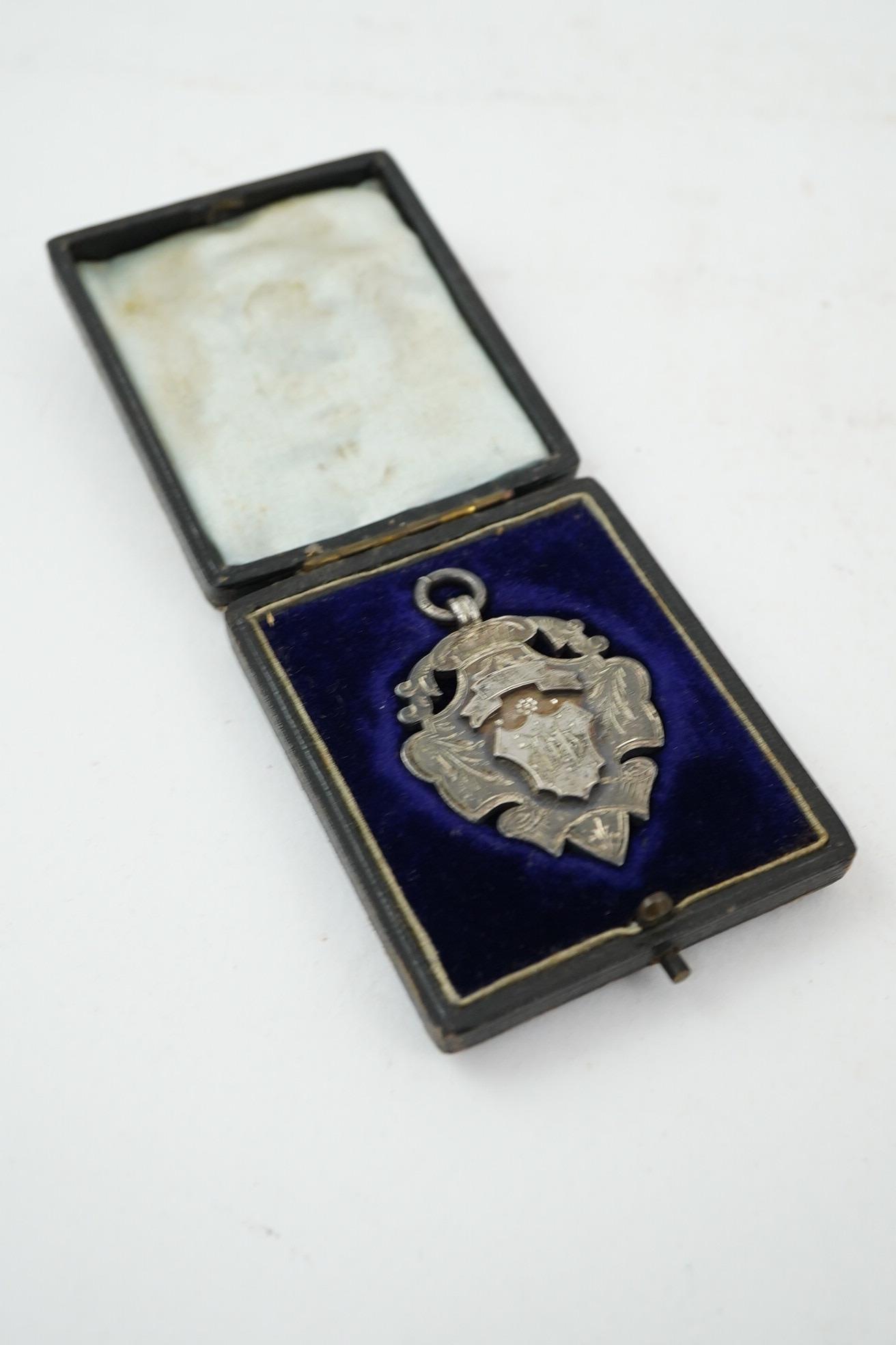 Aston Villa Football Club interest :, a late Victorian silver football medal, inscribed 'B & D.F.L. Championship, Aston Villa F.C. Runners Up 1897/98, W. Hagart [sic]', makers S.A.M., Birmingham, 1897, 44mm, in case of i